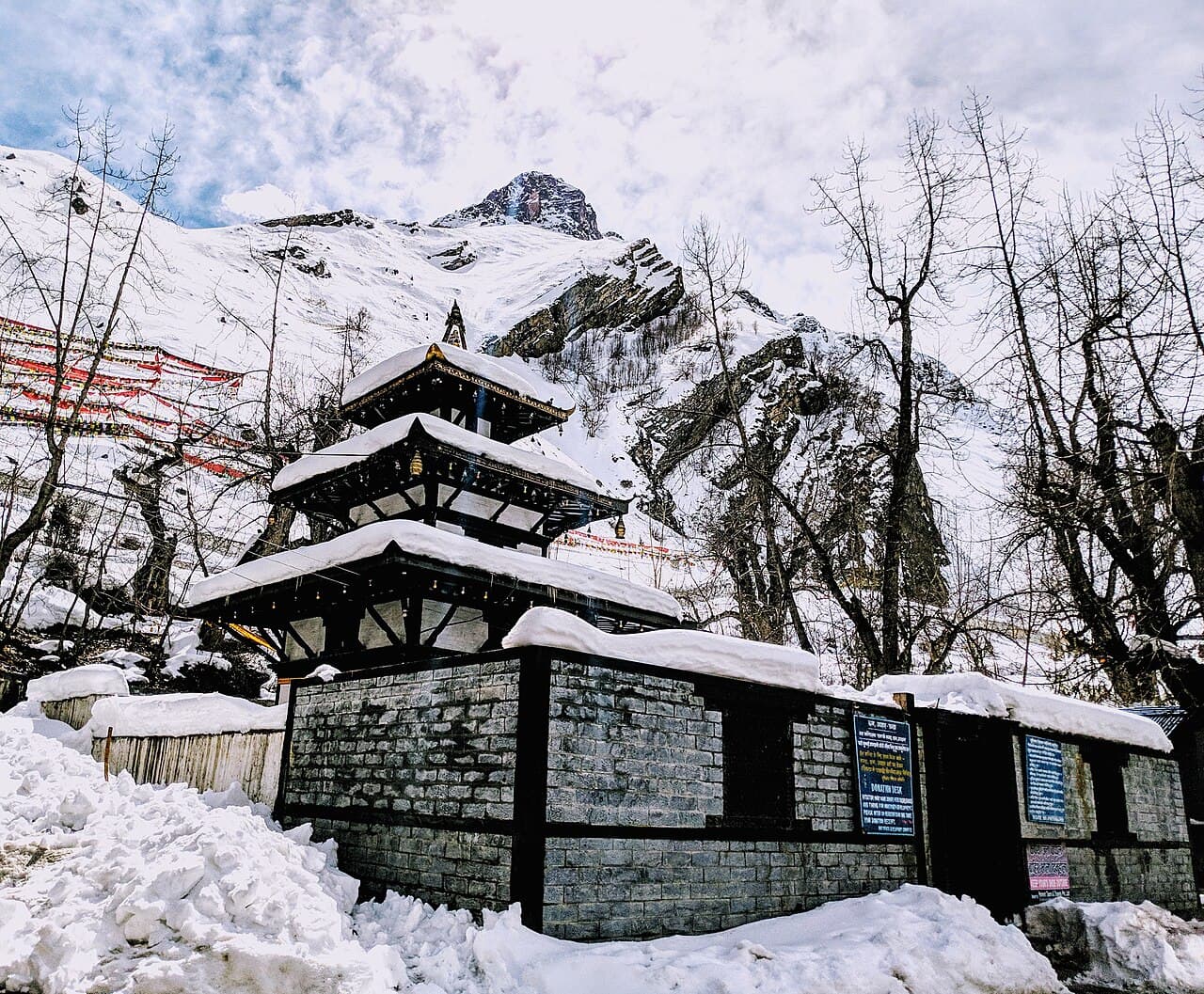 Muktinath Temple surrounded by stone walls in Mustang